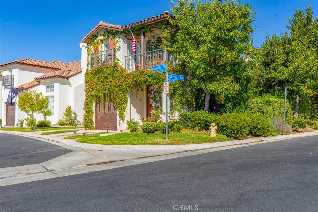 23301 Montecito Place Valencia, CA 91354 - Photo 4 of 45 front view of a house with a street