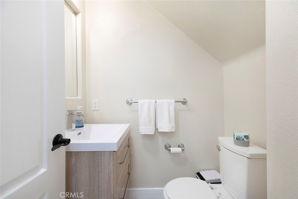 23301 Montecito Place Valencia, CA 91354 - Photo 8 of 45 a bathroom with a sink toilet and a mirror