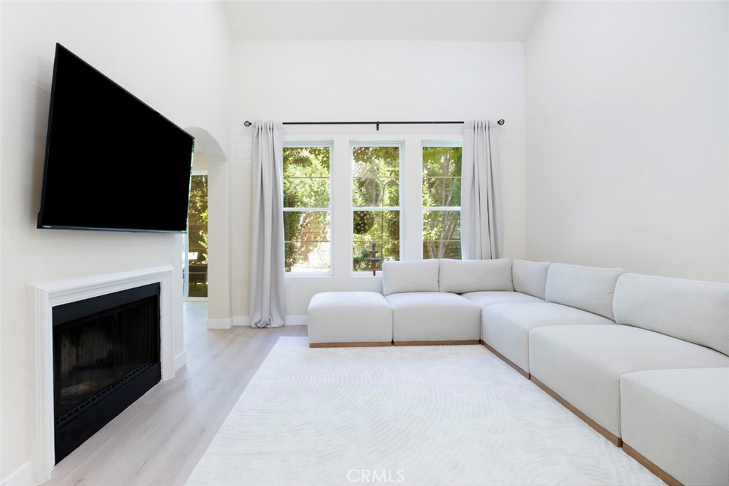 23301 Montecito Place Valencia, CA 91354 - Photo 9 of 45 a living room with fireplace furniture and a flat screen tv