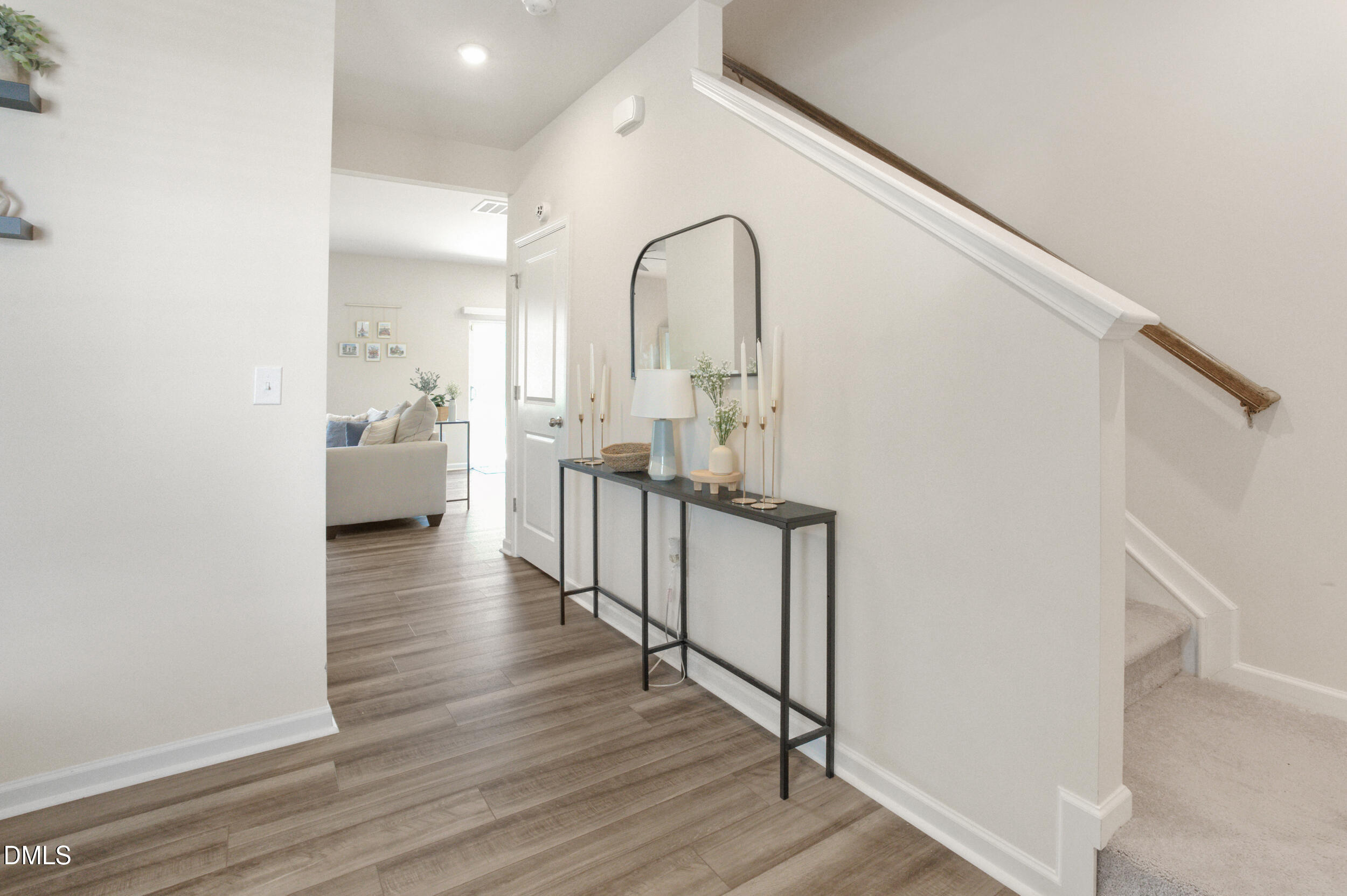 1416 Heron Pond Street Raleigh, NC 27604 - Photo 7 of 25 a view of a hallway with wooden floor and stairs