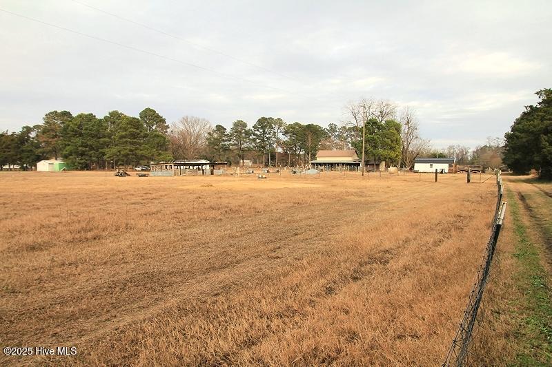 705 Lake Artesia Road Turkey, NC 28393 - Photo 26 of 26 Field with pen barn storage drive access