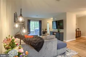 a bedroom with a bed window and couch