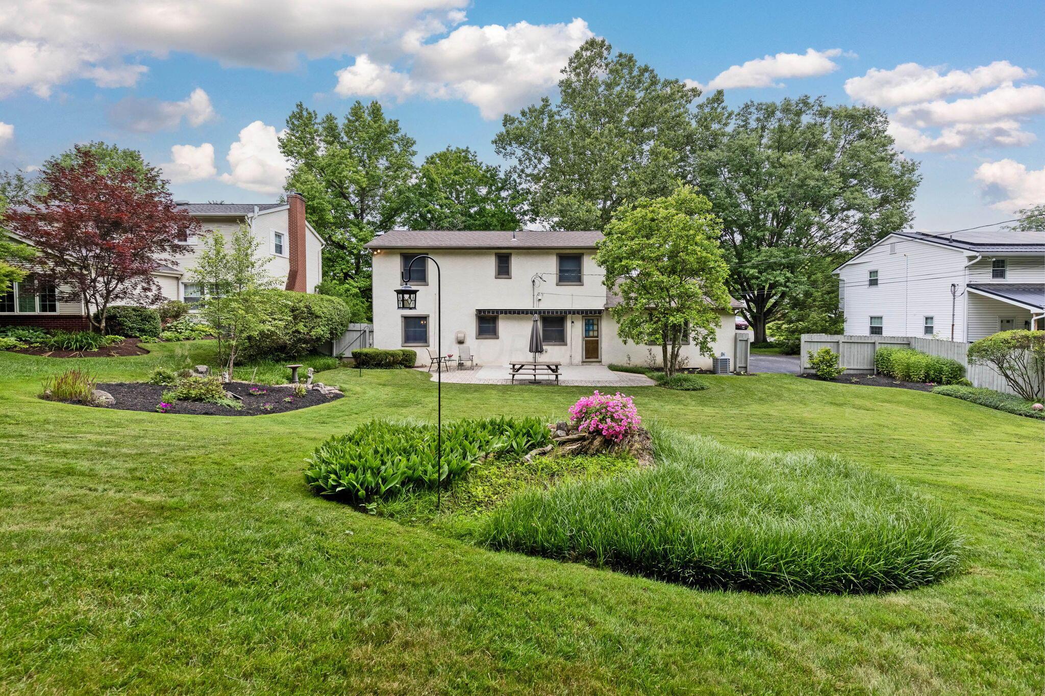 999 Birchmont Road Columbus, OH 43220 - Photo 36 of 53 Gorgeous backyard with multiple beds and areas for play.