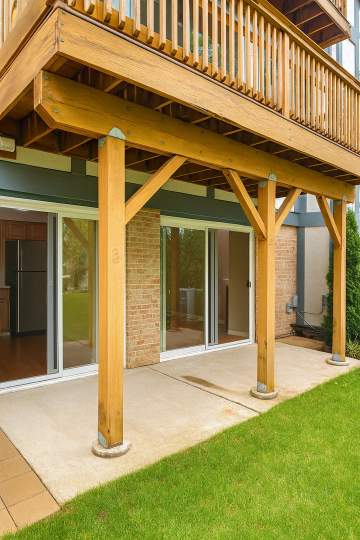 36 West Fern Court, Unit 117B Palatine, IL 60067 - Photo 11 of 11 a front view of a house with a garden