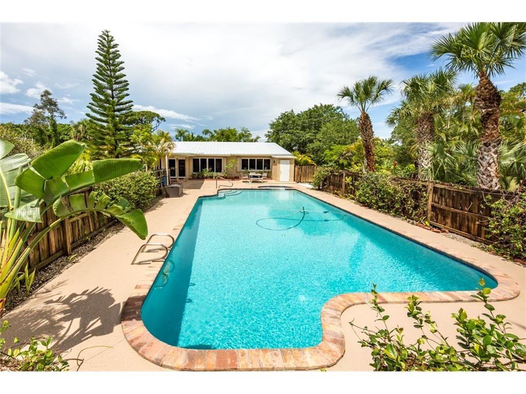 4836 Southeast Manatee Cove Road Stuart, FL 34997 - Photo 3 of 40 a view of a swimming pool with an outdoor space