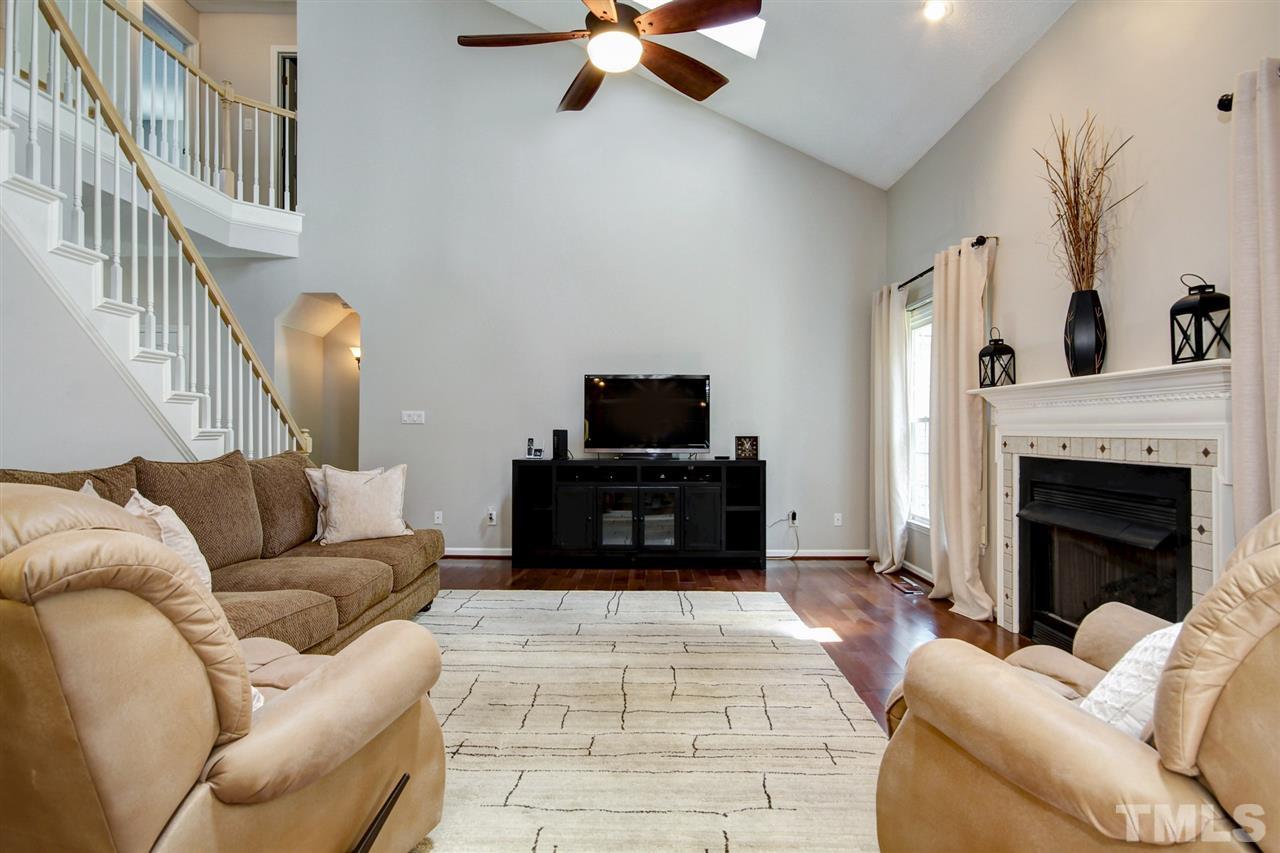 12305 Amoretto Way Raleigh, NC 27613 - Photo 13 of 30 Abundant sunlight and ceiling fan to cool off during the summer or during our NC winters, cozy up to the fireplace and read a great book.