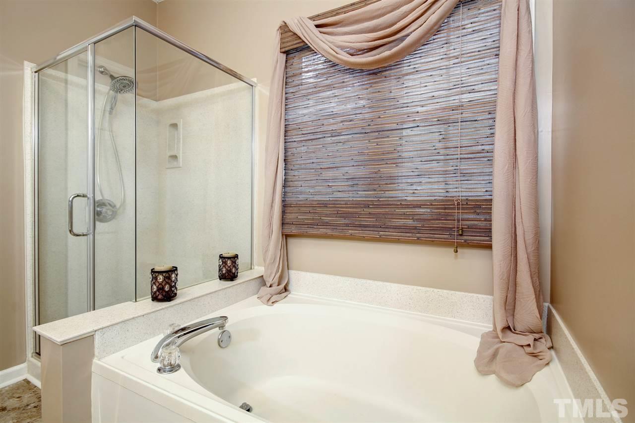 12305 Amoretto Way Raleigh, NC 27613 - Photo 18 of 30 Relax in your soaking tub after a hard day of work or play and catch up on a great book with a glass of wine.