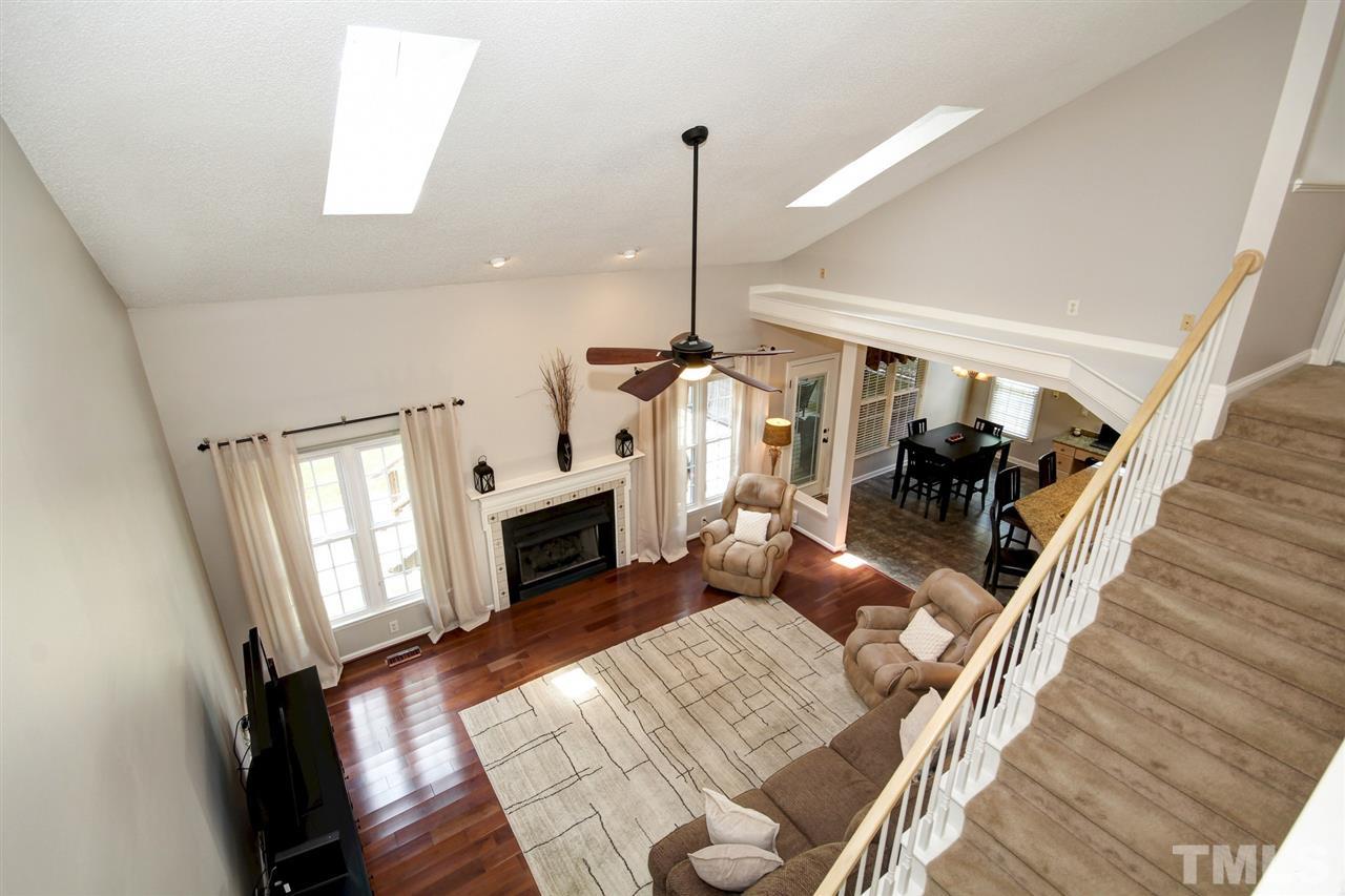12305 Amoretto Way Raleigh, NC 27613 - Photo 19 of 30 View of the family room with ample sunlight through the skylights and soaring ceilings.