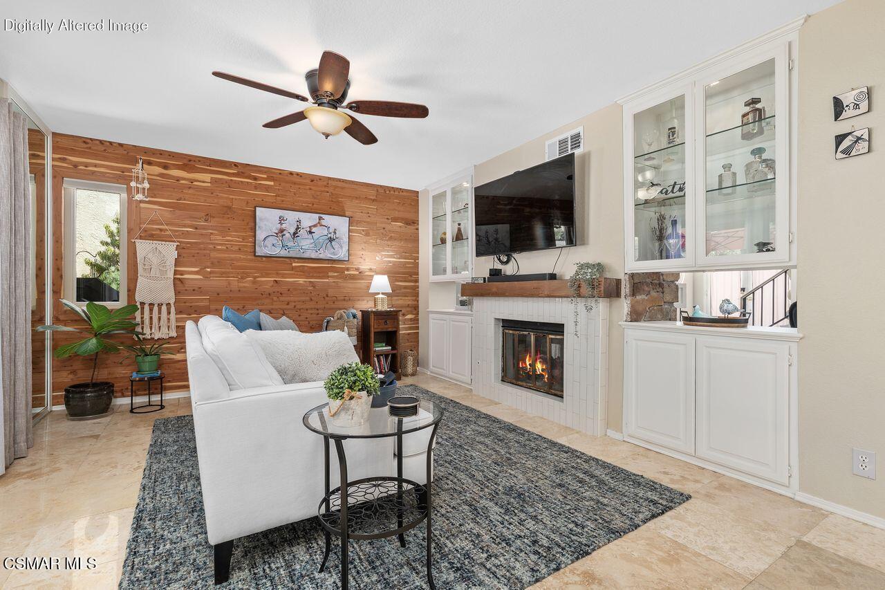 885 Congressional Road Simi Valley, CA 93065 - Photo 16 of 44 a living room with furniture a flat screen tv and a fireplace