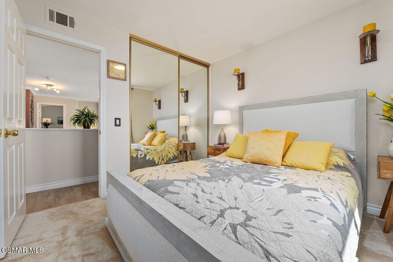 885 Congressional Road Simi Valley, CA 93065 - Photo 27 of 44 a large bed sitting in a bedroom and a table