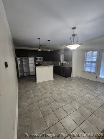 a open kitchen with cabinets