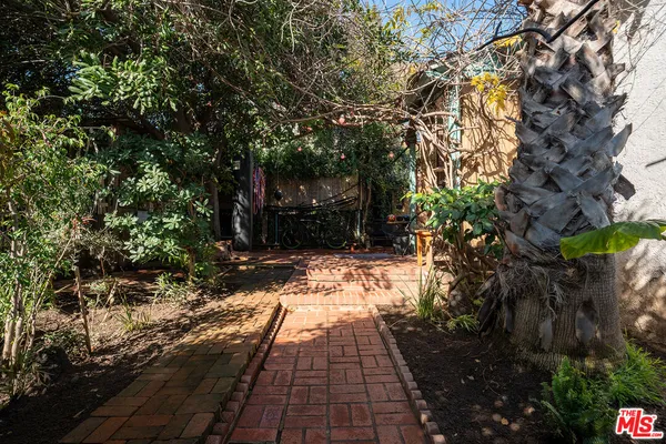 a view of pathway with yard
