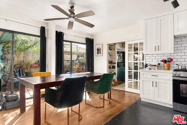 a view of a dining room with furniture window and outside view