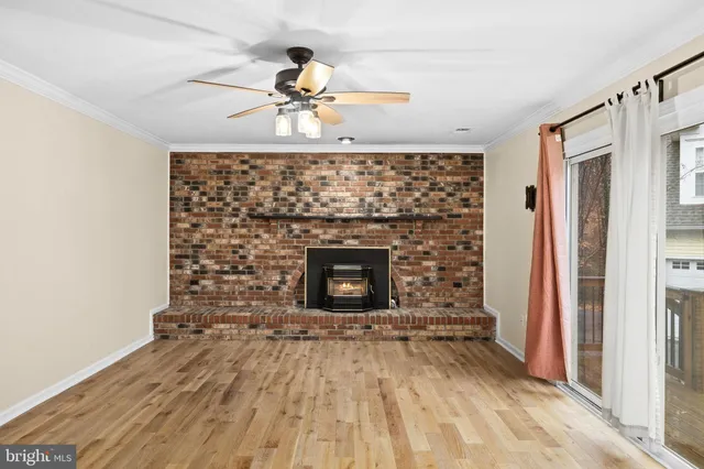 a bedroom with a white bed and a chandelier