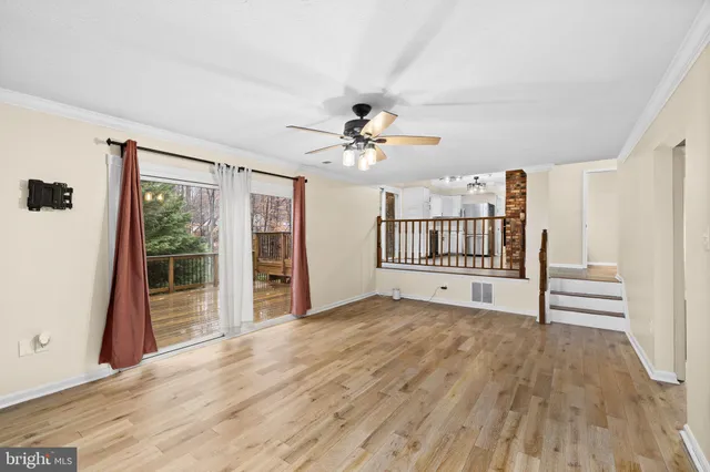 a view of an empty room with stairs