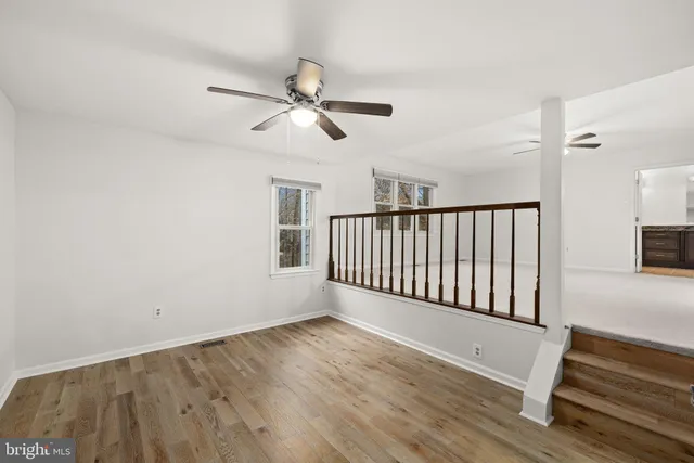 a view of a balcony with wooden floor