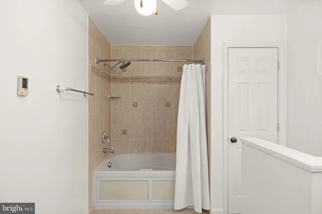 a view of a lake with boats and trees around