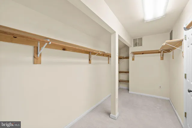 an aerial view of a house with a yard and garden