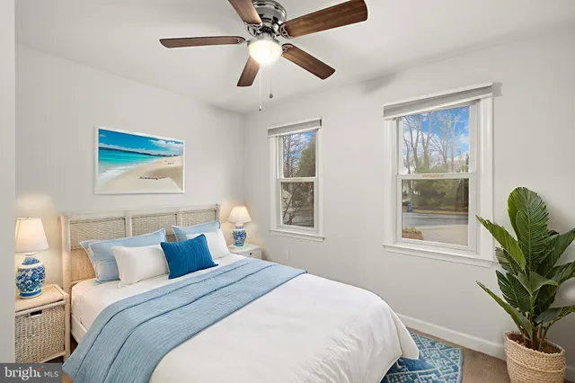 an aerial view of a houses with a yard