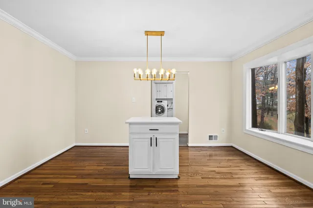 a kitchen with granite countertop a sink and a stove