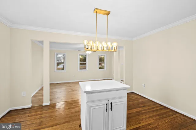 a kitchen with stainless steel appliances a refrigerator sink and cabinets