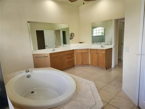 a bathroom with a sink and mirror
