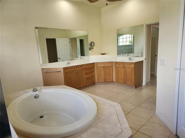 a bathroom with a sink and mirror