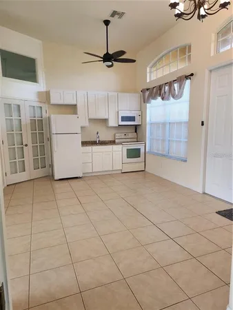 a kitchen with stainless steel appliances cabinets and a counter top space