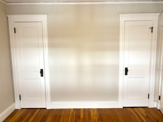 a bathroom with a sink mirror vanity and toilet