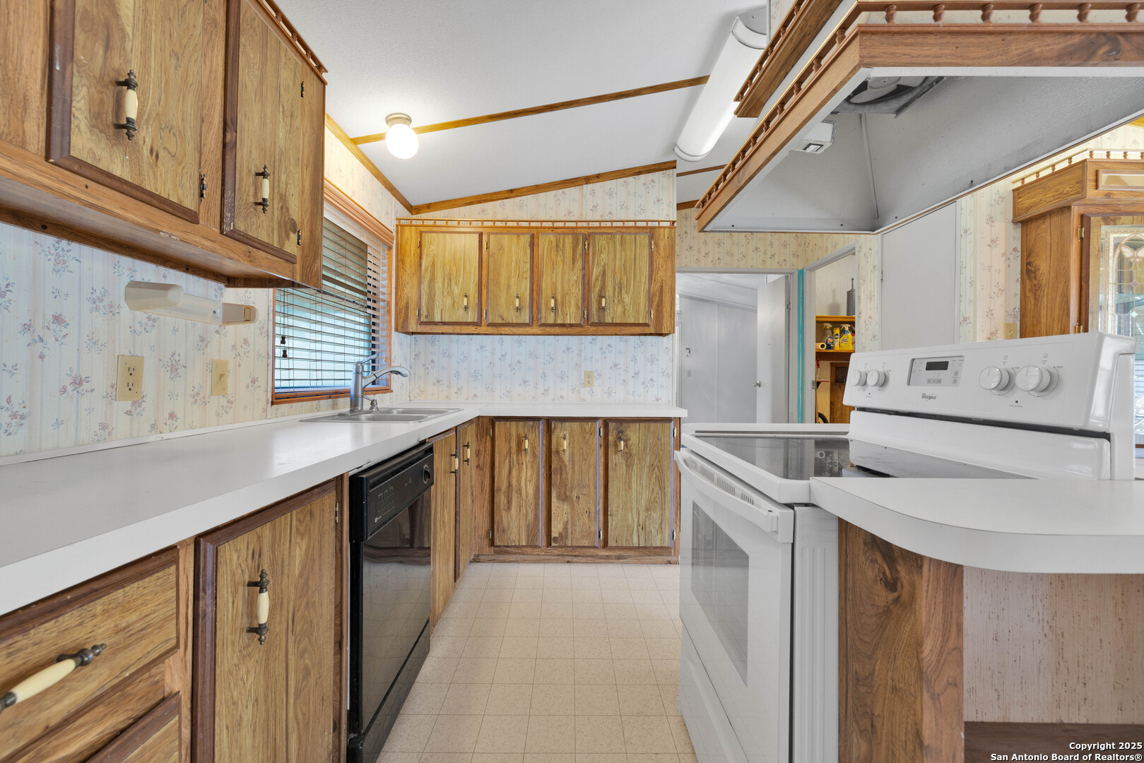 36 Retama Road Brackettville, TX 78832 - Photo 19 of 36 a kitchen with granite countertop a sink stove and cabinets