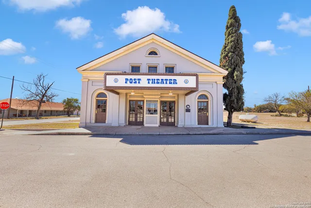 an aerial view of a houses with yard