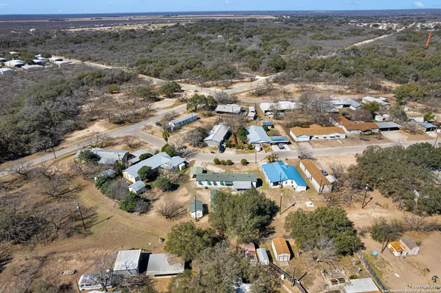 an aerial view of residential building and parking space
