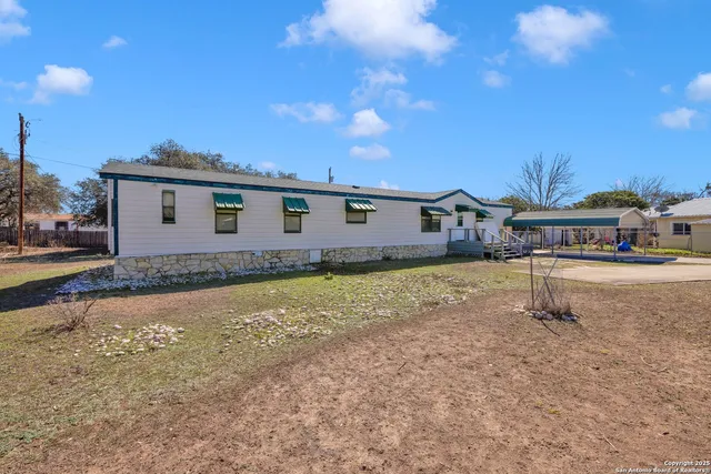 a house view with a swimming pool