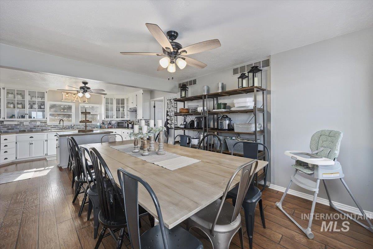899 East 500th Street South Declo, ID 83323 - Photo 23 of 50 Dining space with dark wood-style flooring and a ceiling fan