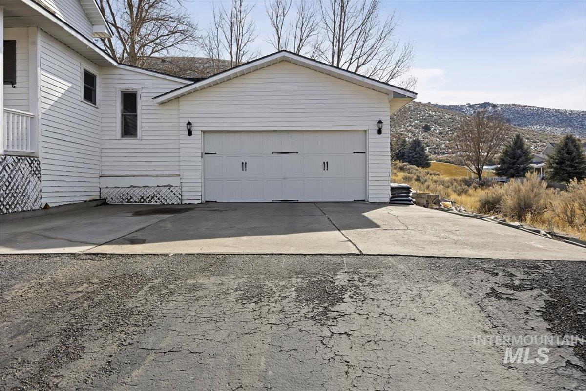 899 East 500th Street South Declo, ID 83323 - Photo 45 of 50 View of side of home with driveway and a mountain view