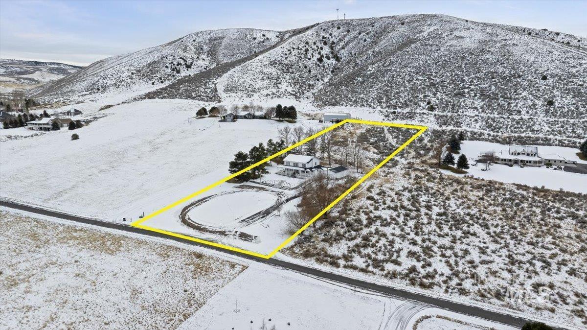 899 East 500th Street South Declo, ID 83323 - Photo 46 of 50 Snowy aerial view with property boundaries highlighted and a mountain view