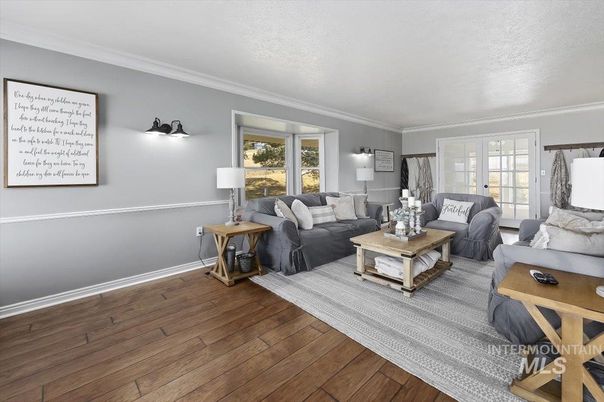 899 East 500th Street South Declo, ID 83323 - Photo 7 of 50 Living area featuring french doors, wood-type flooring, and ornamental molding