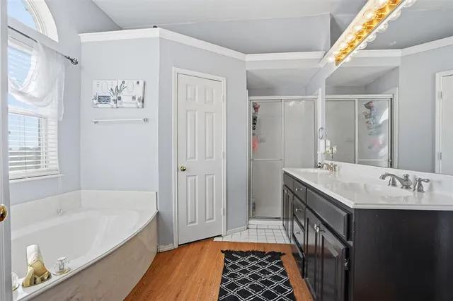 a bathroom with a sink a mirror and a bathtub