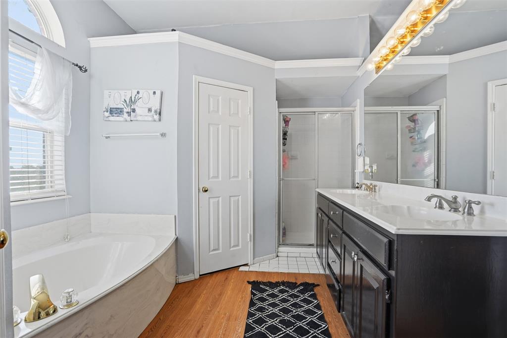 1970 Farm To Market Road 2264 Decatur, TX 76234 - Photo 19 of 27 a bathroom with a sink a mirror and a bathtub