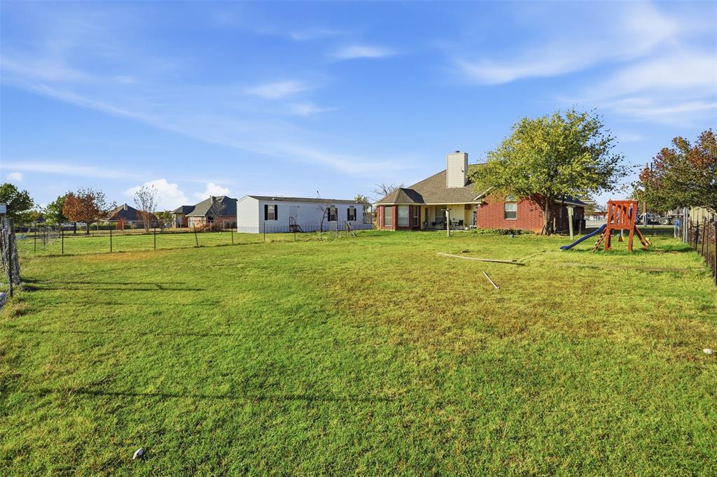 1970 Farm To Market Road 2264 Decatur, TX 76234 - Photo 23 of 27 a view of a big yard with a house in the background