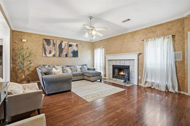 a living room with furniture and a fireplace
