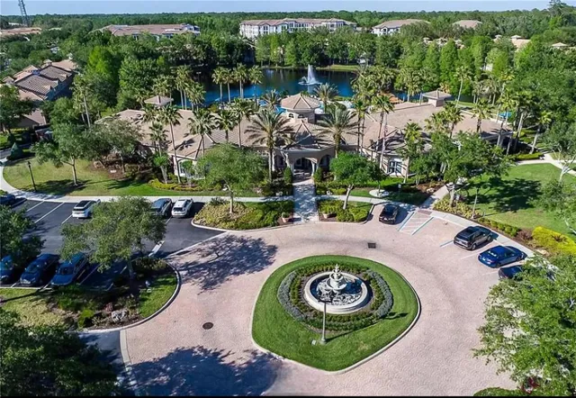 an aerial view of a house with yard swimming pool and outdoor seating