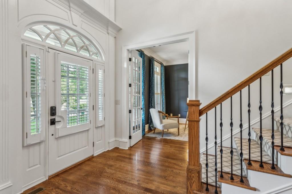 1363 Sylvan Circle Northeast Brookhaven, GA 30319 - Photo 14 of 56 a view of an entryway with wooden floor and windows