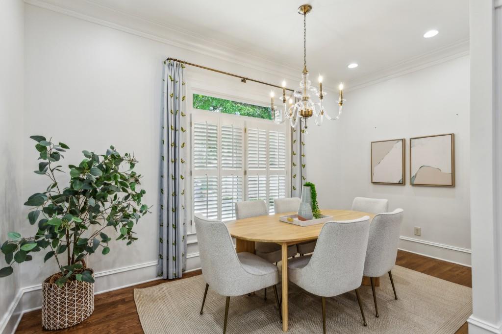 1363 Sylvan Circle Northeast Brookhaven, GA 30319 - Photo 27 of 56 a dining room with furniture potted plants and wooden floor