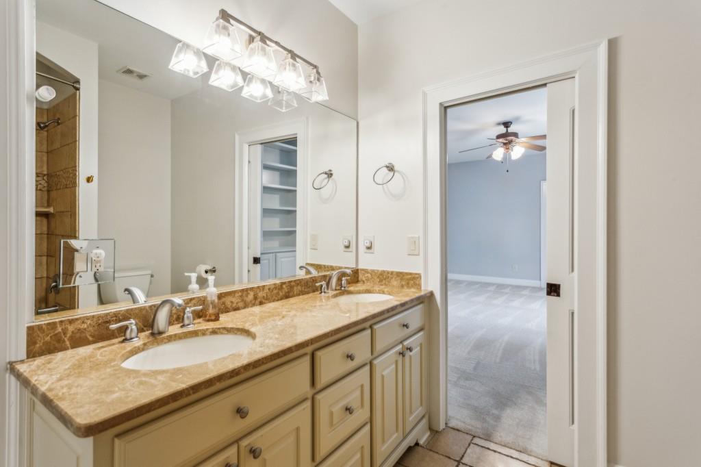 1363 Sylvan Circle Northeast Brookhaven, GA 30319 - Photo 41 of 56 a bathroom with a granite countertop sink and a mirror