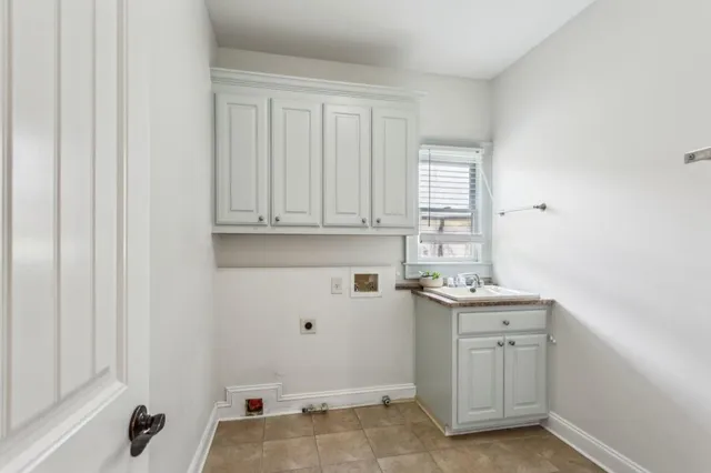 a bathroom with a toilet sink vanity and mirror