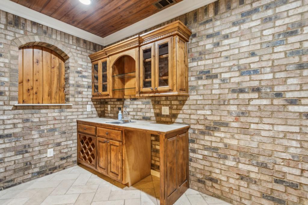 1363 Sylvan Circle Northeast Brookhaven, GA 30319 - Photo 50 of 56 a bathroom with a sink a mirror and a shower
