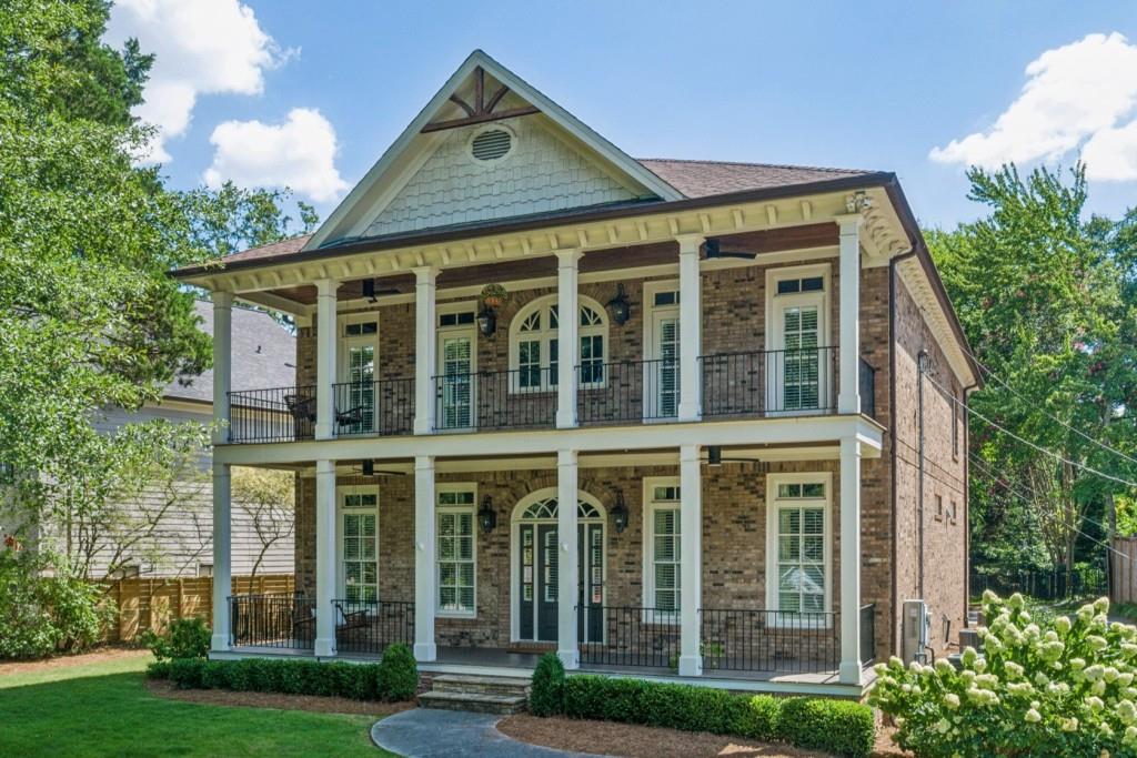1363 Sylvan Circle Northeast Brookhaven, GA 30319 - Photo 9 of 56 a front view of a house with a yard
