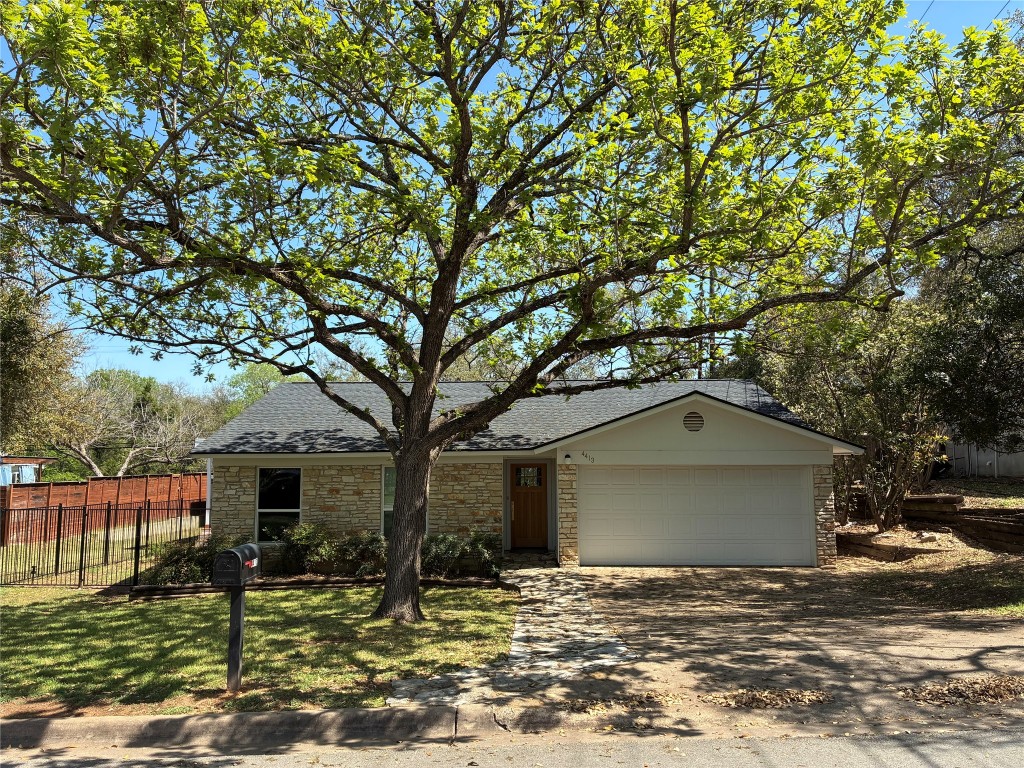 4413 Dudley Drive Austin, TX 78745 - Photo 1 of 1 a front view of a house with garden