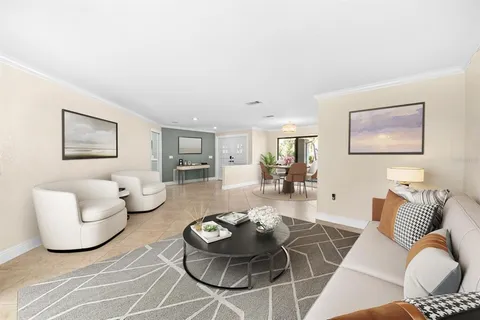 a living room with furniture and a table